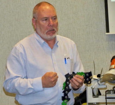 Eddie Anderson, left, technical training supervisor at Stihl Inc., conducts a training session on “Stihl Guide Bars and Saw Chain: Identification and Service Procedures” during the EETC annual conference.