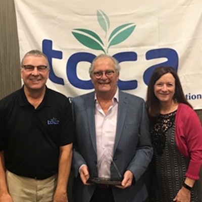 TOCA Executive Director Den Gardner (left) and Project EverGreen Executive Director Cindy Code (right) present Norman Goldenberg with the 2019 Environmental Communicator Award.