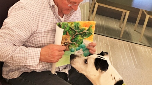 Kris Kiser, President and CEO of the Outdoor Power Equipment Institute (OPEI), pictured here with TurfMutt and the winning entry. “A cornerstone of TurfMutt’s teaching is getting kids to understand that our lawns and greenspaces are urban habitats,' he said.