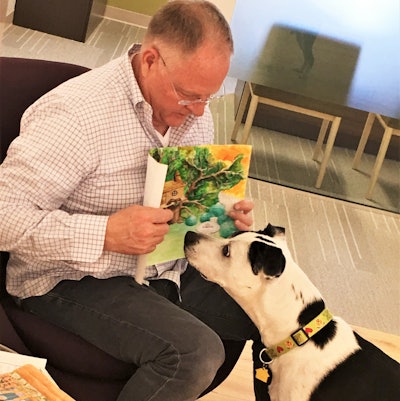 Kris Kiser, President and CEO of the Outdoor Power Equipment Institute (OPEI), pictured here with TurfMutt and the winning entry. “A cornerstone of TurfMutt’s teaching is getting kids to understand that our lawns and greenspaces are urban habitats,' he said.