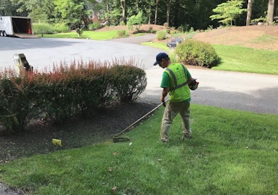 Greg Hemler doing some edging on one of the various properties Edwards Lawn and Home LLC services.