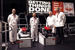 Shane McCoy, senior vice president, Honda Power Equipment Mfg., Takayoshi Fukai, president, Honda Power Equipment Mfg.; Bill Bezilla, chief engineer and Honda Power Equipment Division director, Honda R&D Americas; and William Walton, vice president, American Honda Motor Co. pose with the first lawnmower produced at Honda Power Equipment Mfg. (L) in 1984 and the all new HRN lawnmower following its unveiling at the event in Swepsonville, NC.