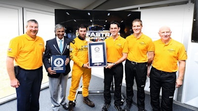 JCB's Tim Burnhope, Pravin Patel, of Guinness World Records, Guy Martin, JCB's Alex Skittery, JCB's Phil Price and JCB's Alan Tolley