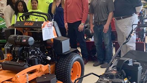 Landeros Reid and family, along with representatives from KOHLER, Medart, and Lawn & Leisure