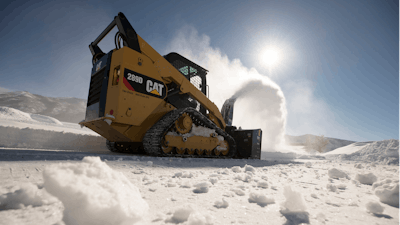 The appeal of either skid steers or compact track loaders for use in snow removal is understandable. Both machines have advantages and disadvantages in snow work. One benefit if the variety of attachments available, such as this Caterpillar 289D Compact Track Loader with SR321 Snow Blower.