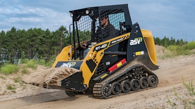 Another benefit of small sit-in compact track loaders is their usability. The size of the machines can make them less intimidating to new operators, and they are easier to operate and learn for the same reason. In this photo, a small sit-in compact track loader hauls a bucket of material