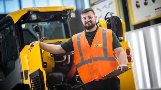 Devin Bass, JCB apprentice and Savannah Tech GOAL student award winner reviews a JCB skid steer during his rotation with the quality team.