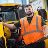 Devin Bass, JCB apprentice and Savannah Tech GOAL student award winner reviews a JCB skid steer during his rotation with the quality team.
