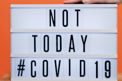 Person S Hand On A Covid19 Sign 3952232