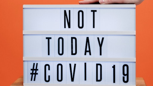 Person S Hand On A Covid19 Sign 3952232