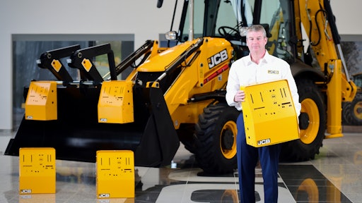 JCB Chief Innovation and Growth Officer Tim Burnhope pictured with the ventilator housing prototypes.