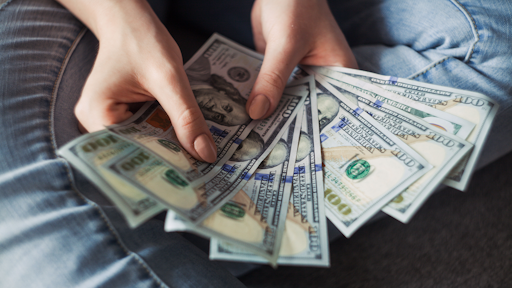 Person Holding 100 Us Dollar Banknotes 2068975