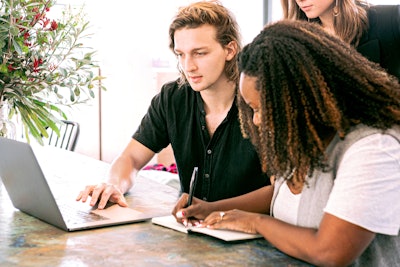 Man Working On Laptop While Woman Takes Notes 3153199