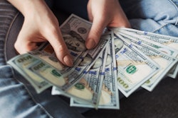 Person Holding 100 Us Dollar Banknotes 2068975