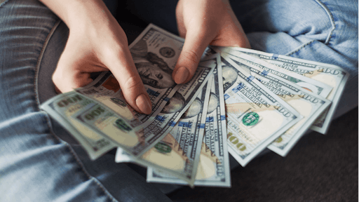 Person Holding 100 Us Dollar Banknotes 2068975