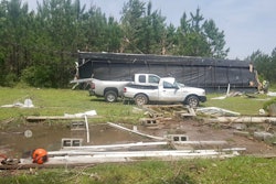 A home, ripped from a concrete foundation by high winds, damaged two trucks and blew into a row of pine trees where it eventually stopped. Fortunately, there were no fatalities as a father and his young child crawled out of the debris from a small hole in the end of the home.