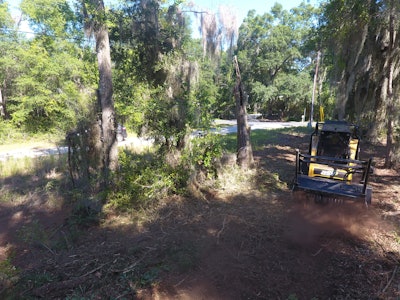 Operator Eliver Hernandez mulches underbrush at a jobsite in Beaufort, South Carolina, using an ASV RT-120 Forestry compact track loader. The machine boasts a 3.8-liter diesel engine that provides 120-horsepower and 360 foot-pounds of torque to power the direct-drive hydraulic motors. It features a rated operating capacity of 3,745 pounds and a tipping weight of 12,255 pounds.
