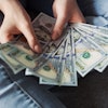 Person Holding 100 Us Dollar Banknotes 2068975 (1)