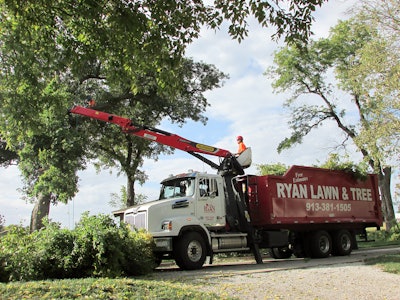 Careful attention is paid to every vehicle representing Ryan Lawn & Tree. Even the large tree-trimming trucks are branded with the RYAN red and white colors and name.