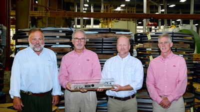 Rotary CEO Ed Nelson, Chief Manufacturing Officer Dennis Lamb, General Manager Tim Cooper and CFO Don Martin proudly display Rotary’s 250 millionth blade that was produced in early 2020.