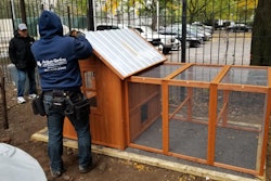 A Chicken Coop Being Installed At Carolina Community Garden In Nyc