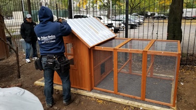 A Chicken Coop Being Installed At Carolina Community Garden In Nyc