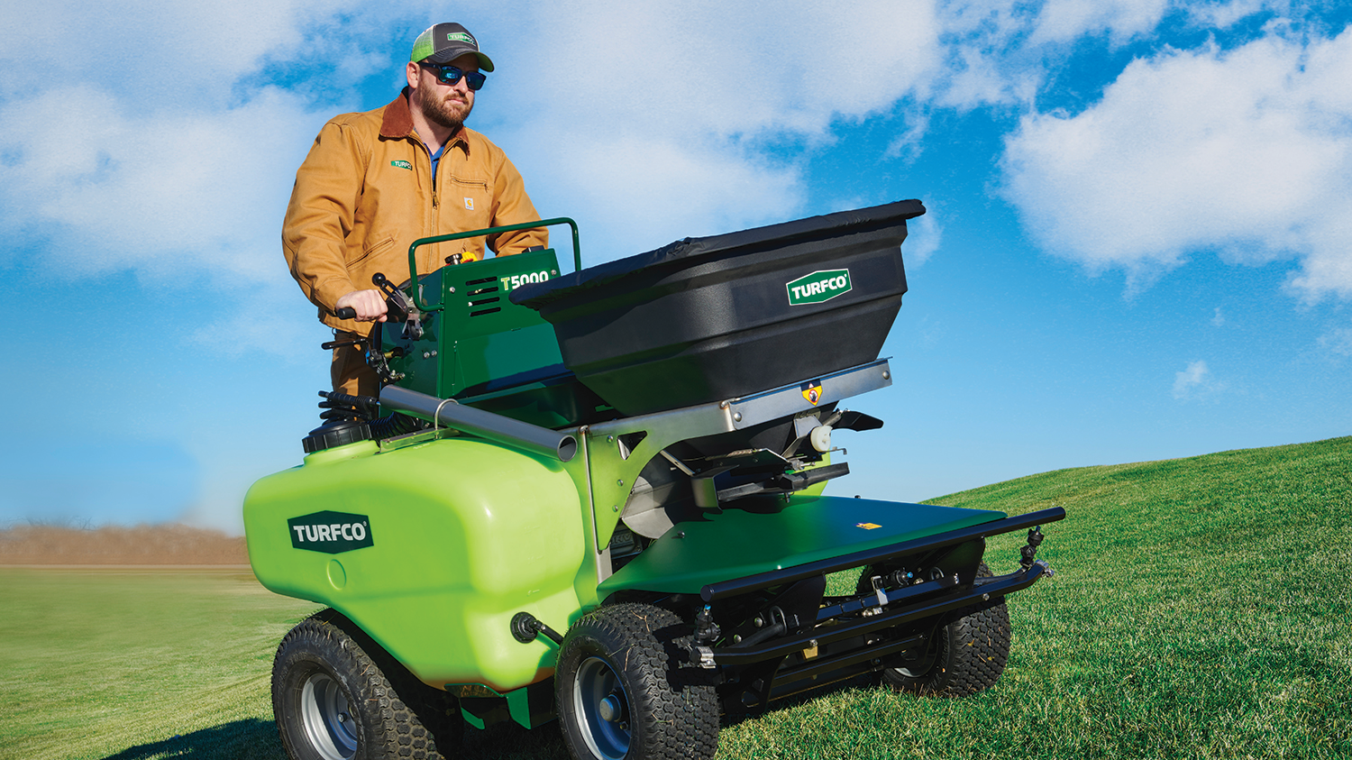 The T5000 has 325 lbs. spreader capacity.