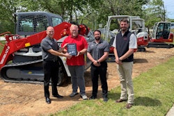 From left to right: John Vranches of Takeuchi presents Bill Smith of Cobb County Tractor with his award for being Takeuchi’s top dealer salesperson in 2020 while Takeuchi’s Steve DePriest and Austin Smith look on.