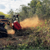 Randy R. Mitchem, Inc. is using a Fecon BLACKHAWK mulcher head such as the one shown to complete a variety of land clearing projects.