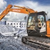 Hitachi Construction Machinery's parent company is selling half its shares in the business.