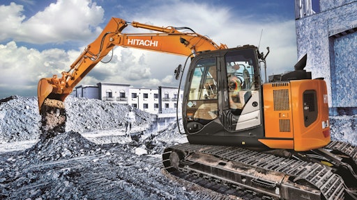 Hitachi Construction Machinery's parent company is selling half its shares in the business.