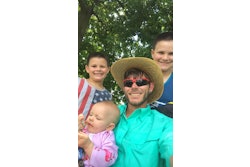 Darren Johnson, owner of Long Term Lawn Care, with his three children.