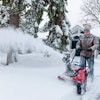 Snow blowers can help snow professionals create clear-cut lines dividing clients' driveways and yards.