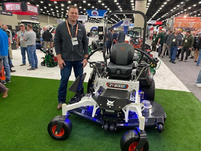 Dan Stibral, product specialist at Bobcat Co., shows off Bobcat's upcoming electric mower, the ZT6000e.