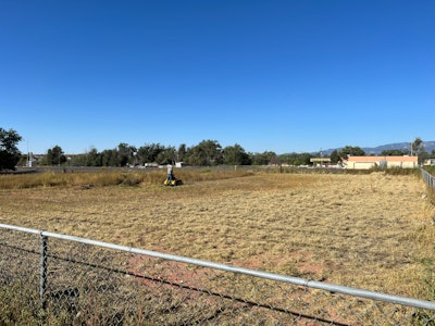 Crew members cleared the properties of tall, unsightly grass so the properties would be ready when it came time for Habitat for Humanity to build houses on them.