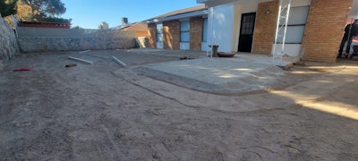 The ground underneath the lawn after crews used an excavator to dig 4 inches deep into the surface.