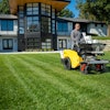 Stand-on spreader-sprayers allow lawn care operators to do more with less.