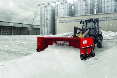 A pusher plow pushing snow.