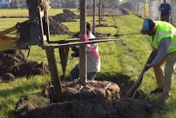 Voluteers at Project Evergreen planting a tree at a park.