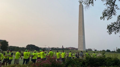 Green industry professionals prepare to tackle projects near the base of the Washington Monument for NALP's Renewal & Remembrance event.
