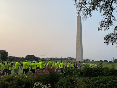 Green industry professionals prepare to tackle projects near the base of the Washington Monument for NALP's Renewal & Remembrance event.