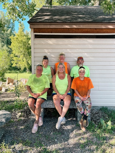 Shelly Fjelstad (front, middle) and other members of Creative Landscaping's staff.