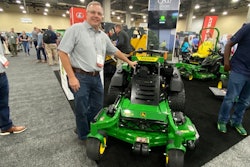 Carl Agee shows off John Deere's new QuikTrak Stand-On Mower.