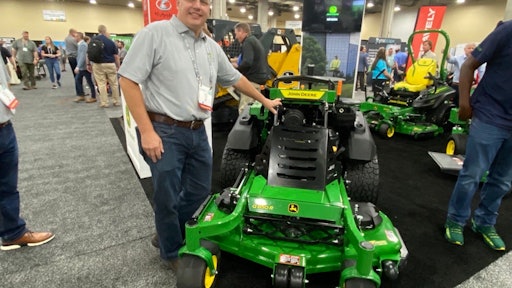 Carl Agee shows off John Deere's new QuikTrak Stand-On Mower.