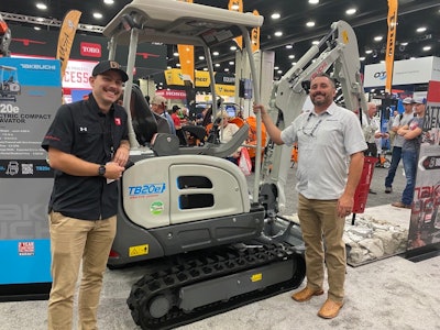 Maxwell Sinclair (left) and Justin Smith (right) show off Takeuchi's new TB20e compact excavator.