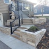 This project involved Overall, the project involved incorporating natural stone retaining walls, bluestone paving and a revamped deck.