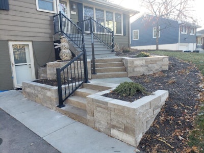 This project involved Overall, the project involved incorporating natural stone retaining walls, bluestone paving and a revamped deck.