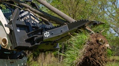 The attachment features dual 3.5- x 4-in. bore cylinders with a clamping force of 29,000 lbs., allowing removal of shrubs and trees along with their roots to prevent regrowth.