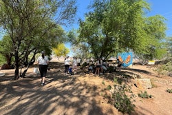 TOCA attendees participate in a Project EverGreen renovation effort at a local bird sanctuary.