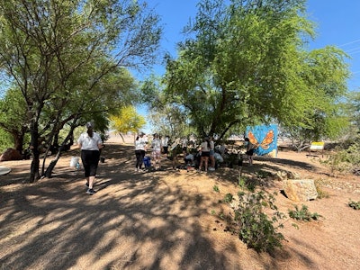 TOCA attendees participate in a Project EverGreen renovation effort at a local bird sanctuary.